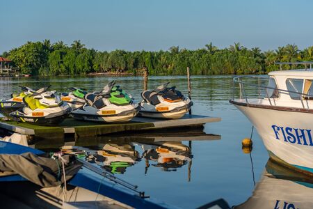 Sports Water. Sunshine over Bentota river, Galle district, Sri Lanka on a perfectly still day under a cloudless sky. Bentota, Sri Lanka.の写真素材