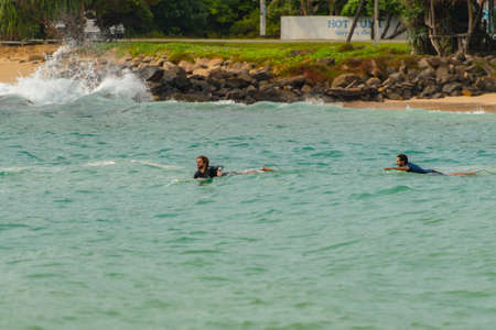 Midigama, Sri Lanka : 2019 NOV 18 :  People surfing the beach whit golden sand in Midigama, Sri...