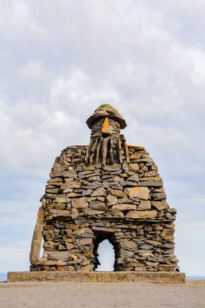 Arnarstapi, Iceland - 13 May 2017: Stone monument to mythological hero Bardur Snaefellsas