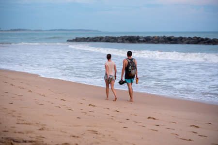 Tangalle, Sri Lanka : 2020 NOV 25 : Young People couple walk the beach in Sunset in the beach of Tangalle, Sri Lanka.のeditorial素材