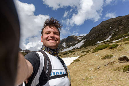 Ordino, Andorra : 2020 may 29 : Young men in the Beautiful view hiking in the Andorra Pyrenees Mountains in Ordino, near the Lakes of Tristaina.のeditorial素材