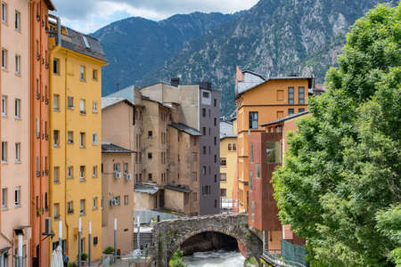 ESCALDES-ENGORDANY, ANDORRA - 2020 juny 8: River Valira on Engordany Bridge and houses view in a snowfall day in small town Escaldes-Engordany in Andorra on juny 2020.のeditorial素材