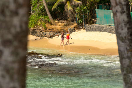 MIrissa, Sri Lanka : 2019 20 Nov : People on a cloudy sunrise on the coconut palm hill in the western province of Mirissa, Sri Lankaのeditorial素材