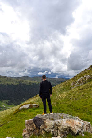 Pas de la Casa, Encamp. Andorra : 2020 17 June : Young Men in a Sunny day with low clouds in the town of Pas de la Casa on the border between Frace and Andorra in June 2020.のeditorial素材