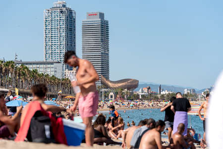 BARCELONA - JUNE 26, 2020: Barceloneta beach with people in summer after COVID 19 on June 26, 2020 in Barcelona, ââSpain.のeditorial素材