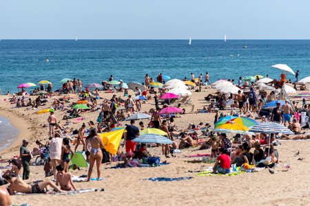 BARCELONA - JUNE 26, 2020: Barceloneta beach with people in summer after COVID 19 on June 26, 2020 in Barcelona, ââSpain.のeditorial素材