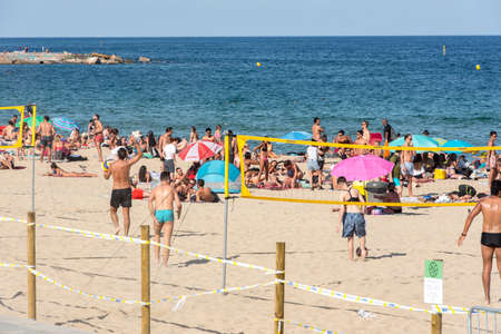 BARCELONA - JUNE 26, 2020: Platja de la Nova IcÃ ria beach with people in summer after COVID 19 on June 26, 2020 in Barcelona, ââSpain.のeditorial素材