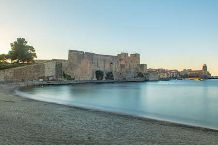 Coliure, France :  2020 june 22 :  Old town of Collioure, France, a popular resort town on Mediterranean sea, panoramic view with the Royal castle in sunrise lightのeditorial素材