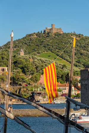 Colioure, France - July 21, 2020: Tourists near chapel of Saint Vincent in sea of Collioure in south...