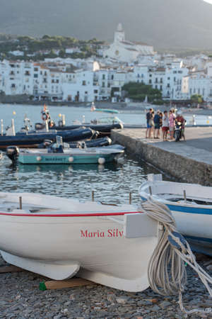 Cadaques, Spain: 07 JULY 2020: Boats in the beach and houses of the village of Cadaques, Spain in summer on 07 July 2020.のeditorial素材