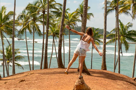 MIrissa, Sri Lanka : 2019 20 Nov : People on a cloudy sunrise on the coconut palm hill in the...