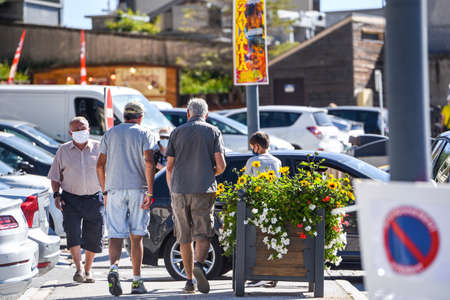 Les Angles, France: 2020 July 19: People walk in summer on Les Angles ski resort city in Sunny day. les Angles, France.のeditorial素材