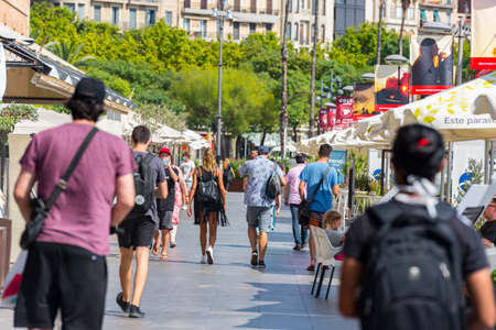 Barcelona, Spain - July 28 2020: People walking through empty streets after COVID 19 LA Barceloneta...