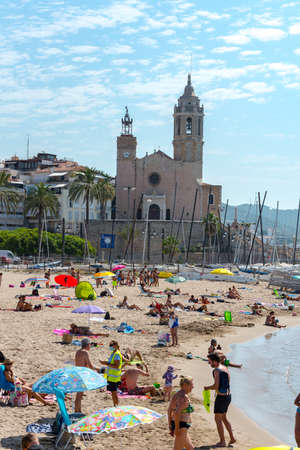Sitges, Catalonia, Spain: July 28, 2020: People in the beach in Sitges in summer 2020.のeditorial素材