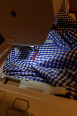 Canillo, Andorra: 2020 August 13: Embroidery with embroidery machine - Text theme - background...