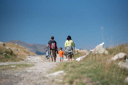 Family walk in sunny day in Els Cortals de Encamp on Andorra, Pyrennes Mountians.の写真素材