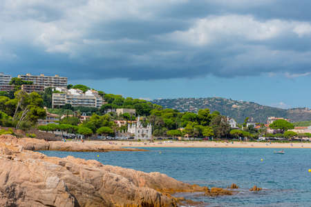 View to Sant Pol beach in the Village of Sant Feliu de Guixols at Costa Brava in Catalonia, Mediterranean Sea, Spain.のeditorial素材