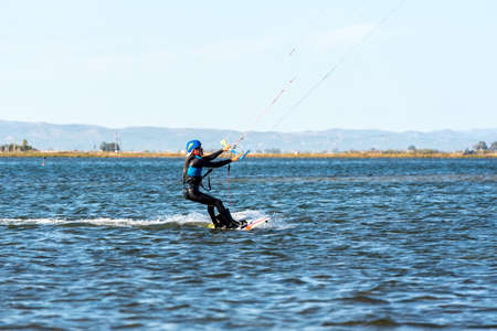 Delta del Ebro, Spain: September 28: People practicing kite Surfing in Platja del Trabucador in the Delta del Ebro, Tarragona, Spain in summer 2020のeditorial素材