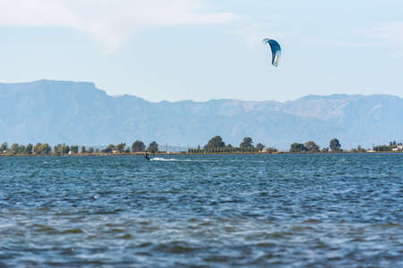 Delta del Ebro, Spain: September 28: People practicing kite Surfing in Platja del Trabucador in the Delta del Ebro, Tarragona, Spain in summer 2020のeditorial素材