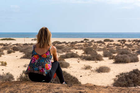 Corralejo, Fuerteventura, Spain: 2020 October 30: Young woman in the Dunas de Corralejo Natural Park in Fuerteventura, Spain in the fall of 2020.のeditorial素材