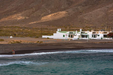 Pozo Negro, Fuerteventura, Spain; 2020 october 7: People walk in the beach of Pozo Negro on the island of Fuerteventura, Spain.のeditorial素材