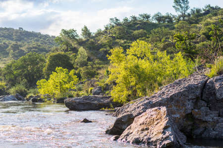 Sunset on the Quilinzo River in Villa CaÃ±ada del Sauce, Cordoba, Argentina.の写真素材