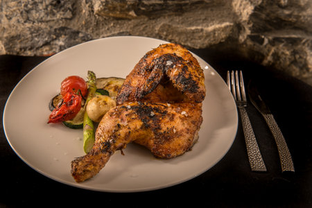 Grilled chicken with potatoes.の写真素材