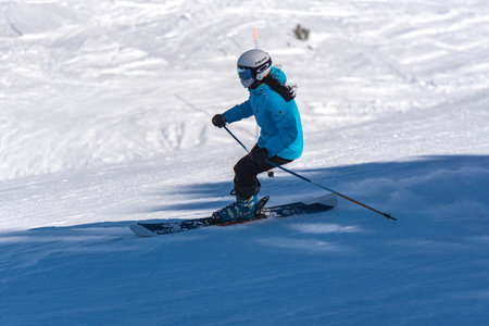 Pas de la Casa, Andorra: January 3, 2021: Young woman skiing in the Pyrenees at the Grandvalira ski resort in Andorra in Covid19 timeのeditorial素材