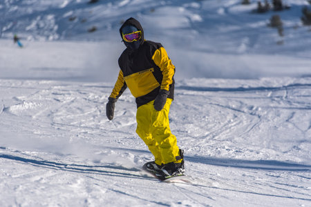 Pas de la Casa, Andorra: 2021 January 03: Young man skiing in the Pyrenees at the Grandvalira ski resort in Andorra in Covid19 timeのeditorial素材