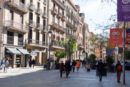 Barcelona, Spain: 2021 February 12: People walk along the Barcelona promenade in time of Covid 19 in winter 2021.のeditorial素材