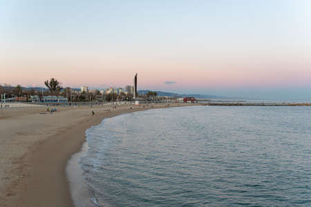 Barcelona, Spain - Febrary, 2021 - Sunset in Nova Icaria Beach in the Barcelona area on the Mediterranean on winter 2021のeditorial素材