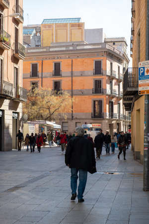 Barcelona, Spain: 2021 February 12: People walk along the Barcelona promenade in time of Covid 19 in winter 2021.のeditorial素材