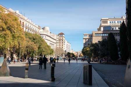Barcelona, Spain: 2021 February 12: People walk along the Barcelona promenade in time of Covid 19 in winter 2021.のeditorial素材