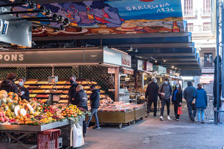 Barcelona, Spain: 2021 February 11: People in the Sant Josep La boqueria market in Winter 2021 in times of covid 19 in Barcelonaのeditorial素材