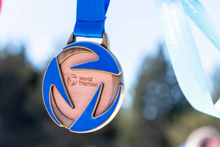 Naturlandia, Andorra: 2021 March 20: Medals to the winners in the 2021 World Triathlon Winter...