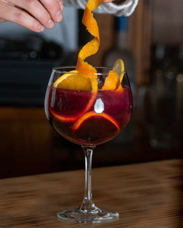 Sangria drink in glass isolated on a wooden table.の写真素材