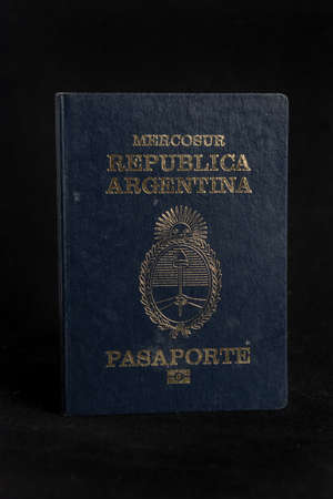 Argentinian passport in background black.のeditorial素材