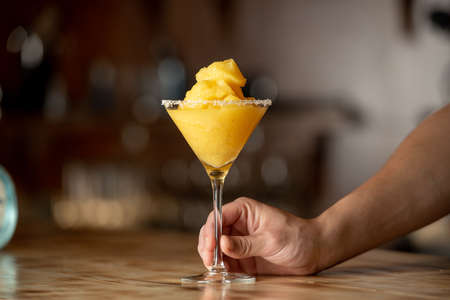 Frozen margarita cocktail on wooden bar.の写真素材