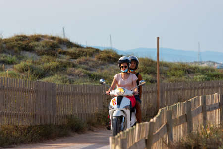 Formentera, Spain: 2021 June 13: Tourists riding motorcycles on Illetes Beach in Formentera in Spain in times of Covid19のeditorial素材
