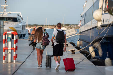 Formentera, Spain: 2021 June 14: People at the pier of La Marina de Formentera in Spain.のeditorial素材