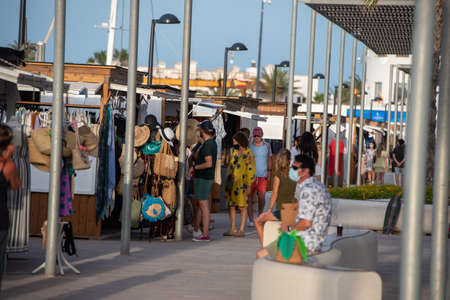 Formentera, Spain: 2021 June 14: People at the pier of La Marina de Formentera in Spain.のeditorial素材