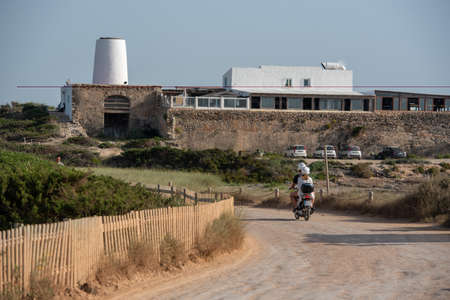 Formentera, Spain: 2021 June 13: Tourists riding motorcycles on Illetes Beach in Formentera in Spain in times of Covid19のeditorial素材