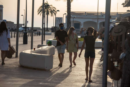 Formentera, Spain: 2021 June 13: Tourists cycling on the Illetes Beach in Formentera in Spain in times of Covid19のeditorial素材