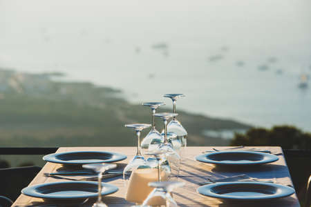 Restaurant overlooking the island of Formentera in the Balearic Islands in Spain at sunset.の写真素材