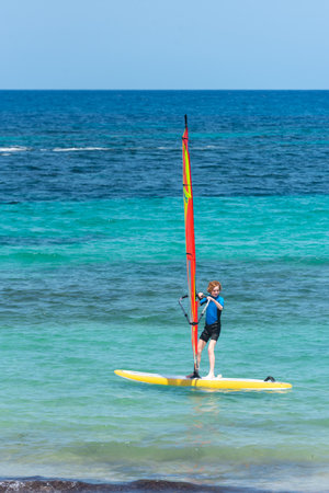 Formentera, Spain: July 11, 2021: People on the beach at Es Pujols beach in Formentera in summer 2021のeditorial素材