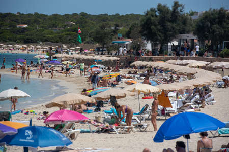 Formentera, Spain: July 11, 2021: People on the beach at Es Pujols beach in Formentera in summer 2021のeditorial素材