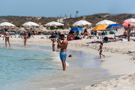 Formentera, Spain: 2021 July 05: People in the Levante beach in Formentera, Spain in summer 2021.のeditorial素材