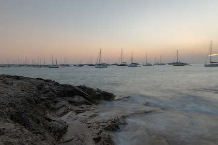 Sunset on the beach of Ses Illietes on the Island of Formentera in the summer of 2021.のeditorial素材