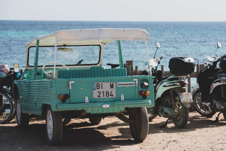 Formentera, Spain: 2021 August 17: Retro Citroen Mehari in light blue and white on Mijorn beach in Formentera, Spain.のeditorial素材