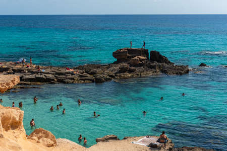 Formentera, Spain: 2021 June 04: People in Formentera beach of Calo d es Mort in Balearic Islands in summer 2021のeditorial素材